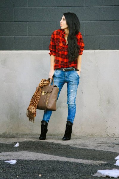 red and black shirt with blue jeans and high-heeled suede boots