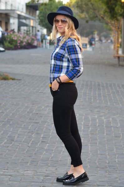 blue and white checked shirt with black skinny jeans and felt hat
