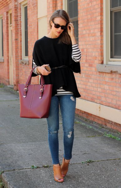 black wide-sleeved sweater over striped long-sleeved T-shirt