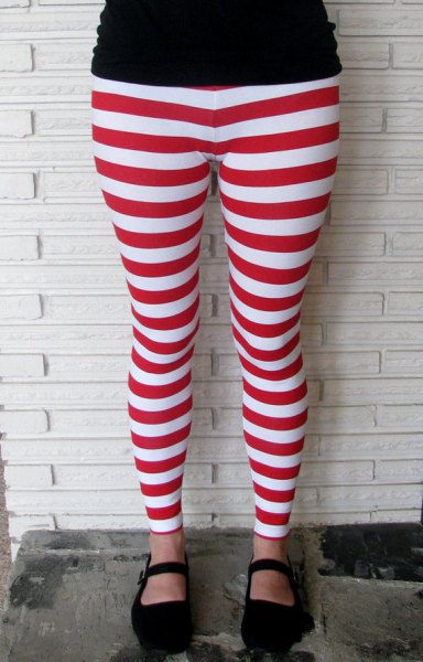 black t-shirt with red and white striped leggings and loafers