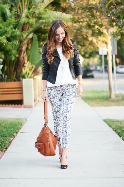black leather jacket with white t-shirt and floral leggings