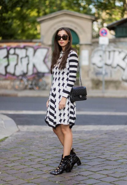 black and white striped mini dress with pointed leather toe boots