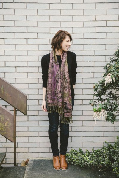 black sweater with pashmina scarf with tribal print and dark skinny jeans