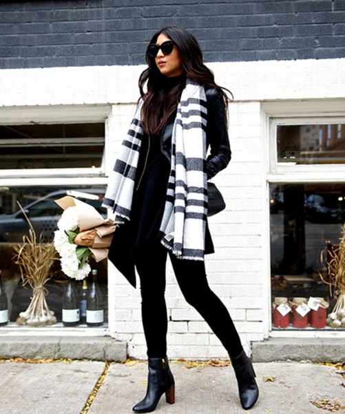 Black and white scarf with mock-neck sweater and leather jacket