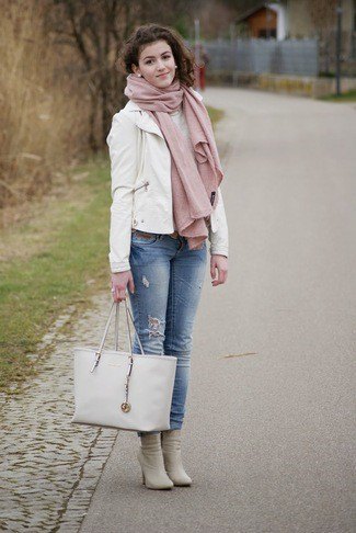 white leather blazer with blue cuffed jeans and pink heeled boots