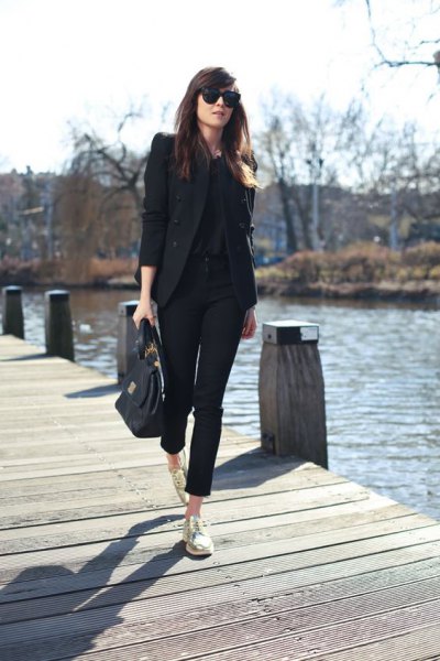 black blazer with shortened chinos and gold low-top sneakers