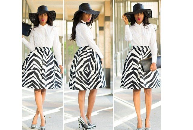 white shirt with buttons, flared midi skirt with zebra print and floppy church hat