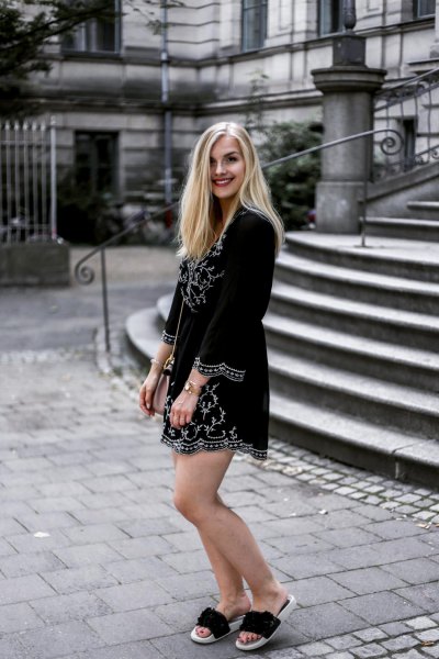 black printed long-sleeved mini dress with golden slippers