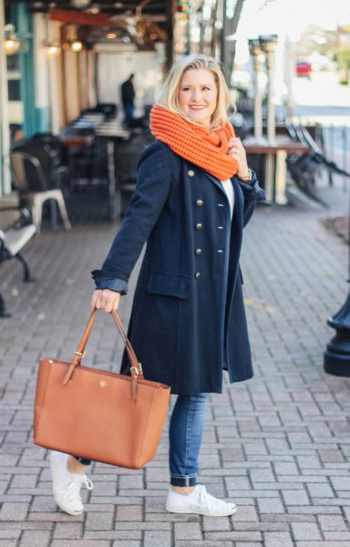 Dark blue longline wool coat with jeans and white sneakers