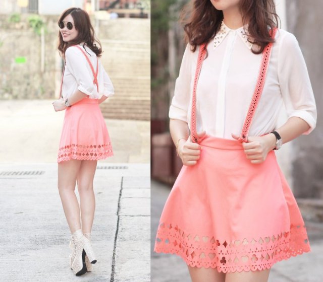 white shirt with buttons and blushing pink suspender mini-skirt