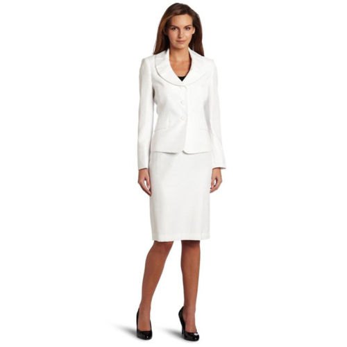 white blazer with round collar, skirt and black, rounded toe heels made of leather