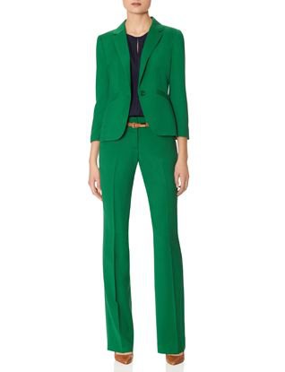 green suit jacket with high-waisted trousers with straight legs