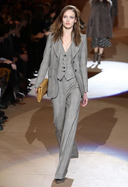 gray checked suit with wide-leg trousers and brown leather handbag