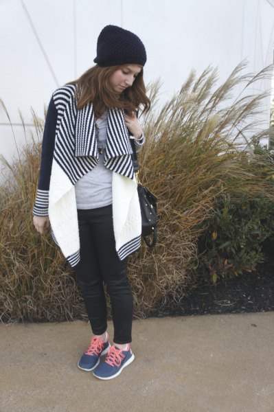 black and white striped color block jacket with dark blue sneakers