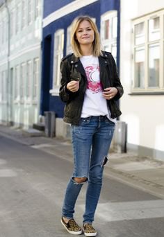 black denim blazer with torn blue jeans and canvas shoes with animal print
