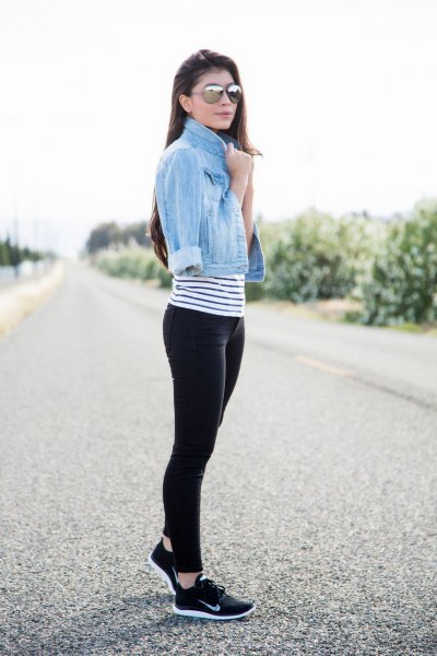 light blue short denim jacket with striped t-shirt and black and white hiking shoes