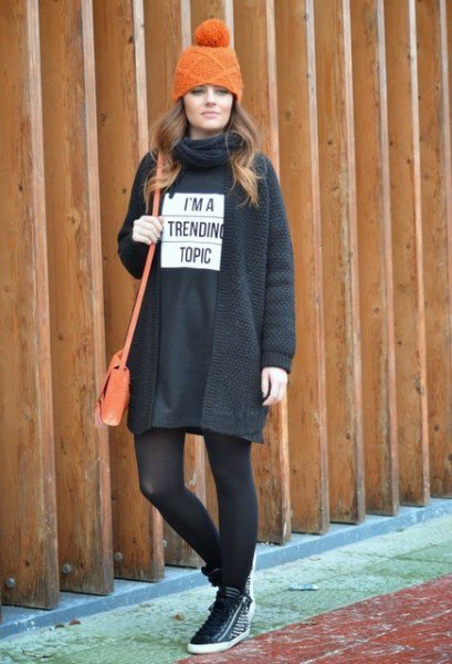 black sweatshirt dress with stockings and hiking shoes