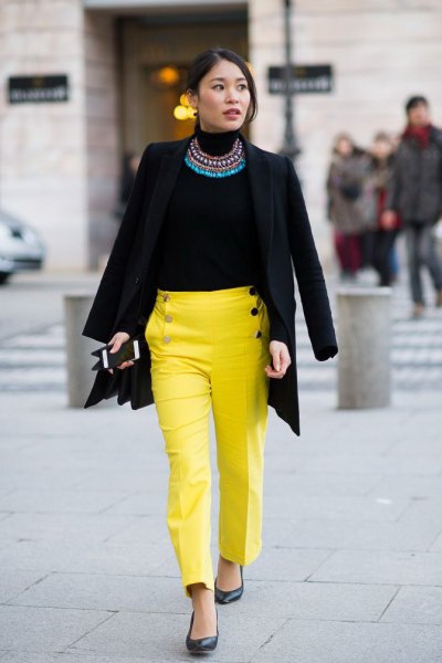 black blazer with statement chain and yellow chinos with straight legs