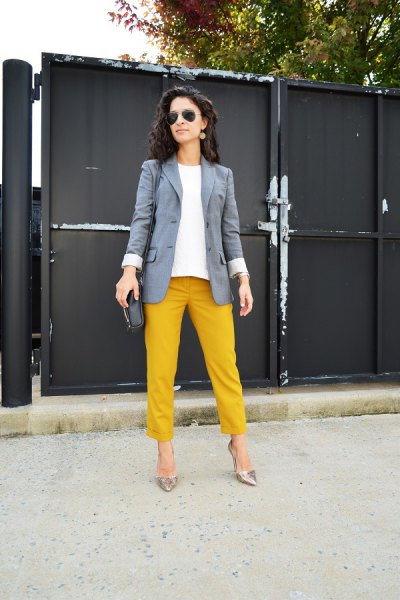 gray blazer with straight yellow trousers with cuff