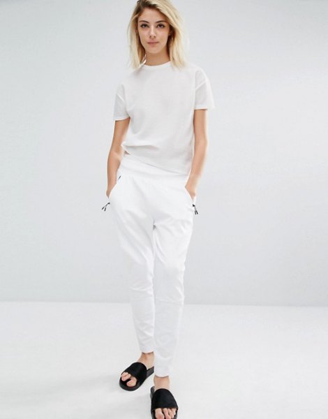 white t-shirt with matching trousers and black sandals