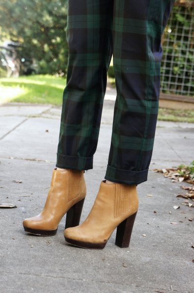 green checked pants with light brown leather boots with ankle heel