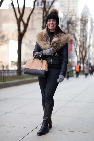 black leather jacket with fur collar, knitted hat and knee-high boots