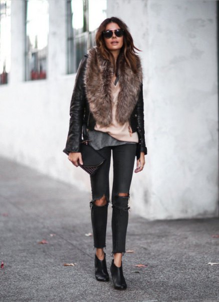 black leather moto jacket with faux fur collar and torn jeans