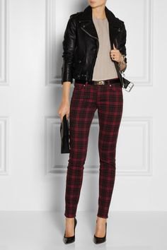 black moto jacket with gray blouse and checked pants