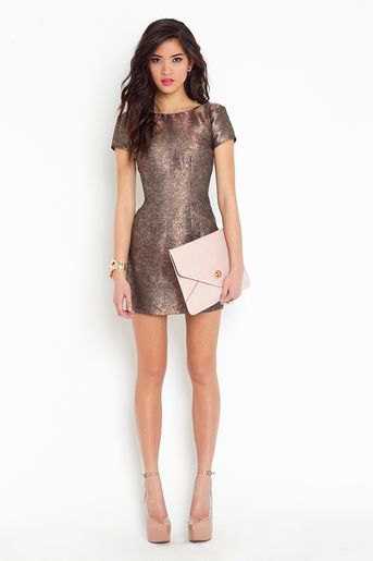 gray, form-fitting mini metallic dress with light pink leather clutch