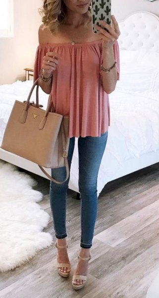 Blush pink off the shoulder blouse with blue skinny jeans