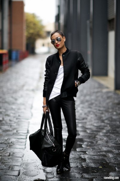black pilot jacket with white tank top and leather boots
