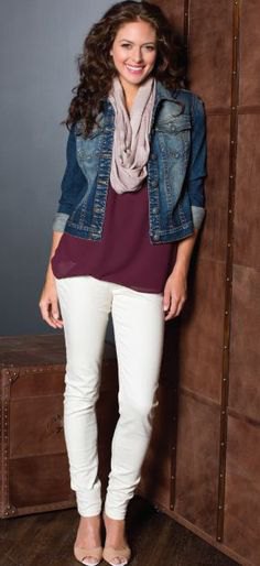 black tunic shirt with blue denim jacket and cream-colored slim fit jeans