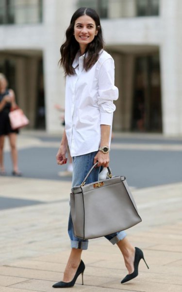 white shirt with buttons, blue boyfriend jeans with cuffs and pink purse