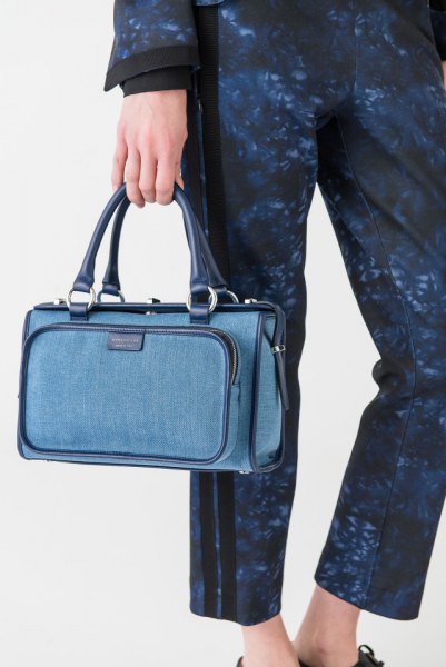 washed blue long-sleeved coat with matching trousers and jeans handbag