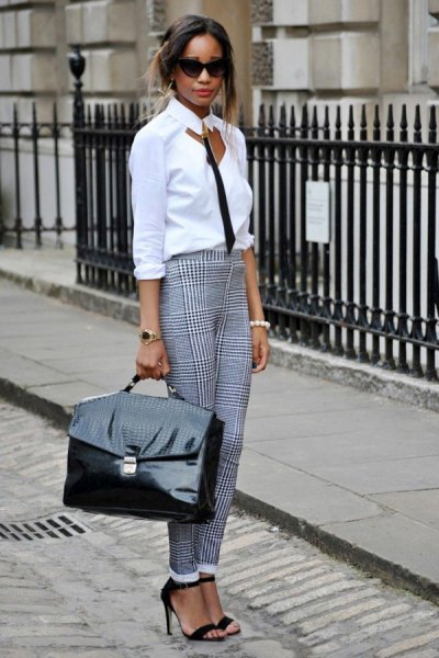 white and black blouse with checked chinos
