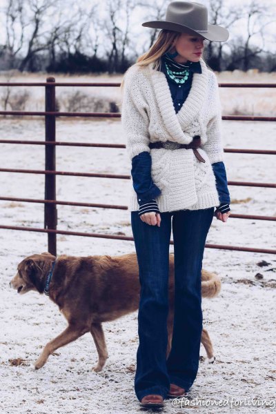 white sweater with belt, blue flared jeans and black square toe boots