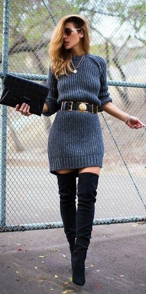 gray sweater dress with belt and over the knee boots made of black suede