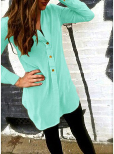Mint green, collarless tunic shirt with buttons and black leggings