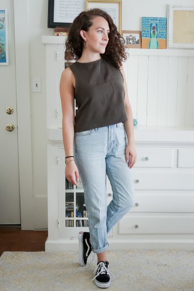 Olive green sleeveless top with light blue boyfriend jeans