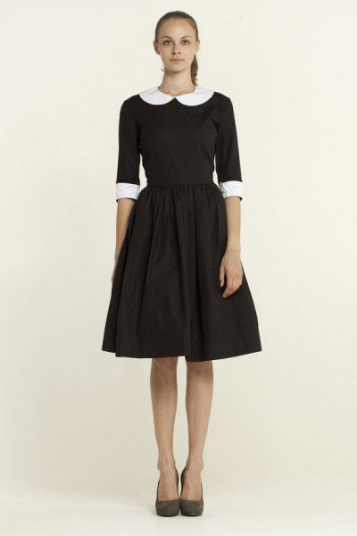 black, half-sleeved, flared mini dress with a round collar