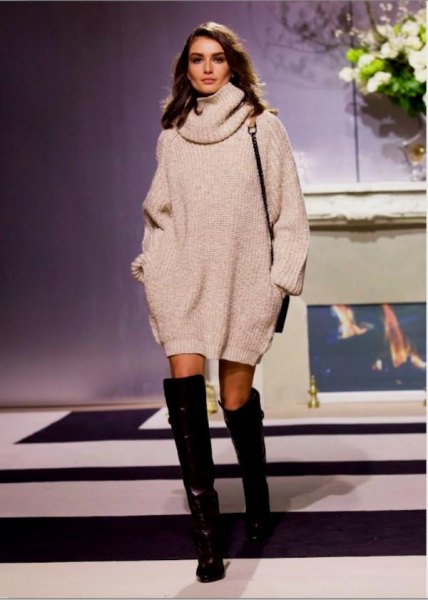 white turtleneck sweater dress with black, thigh-high leather boots