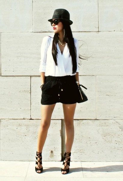 white wrap blouse with black mini short hat and flat hat
