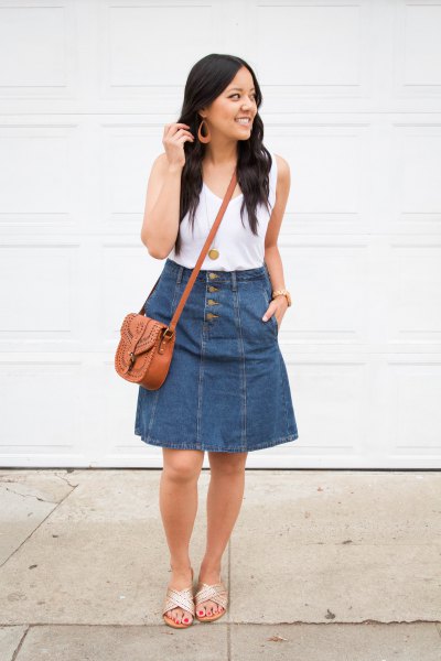 white tank top with a scoop neck and knee-length skirt in blue denim