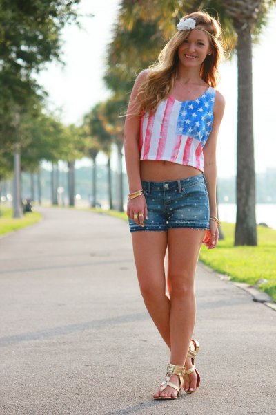 Short tank with an American flag, denim shorts and gold sandals