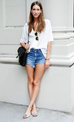 white shirt with buttons and blue mini denim shorts