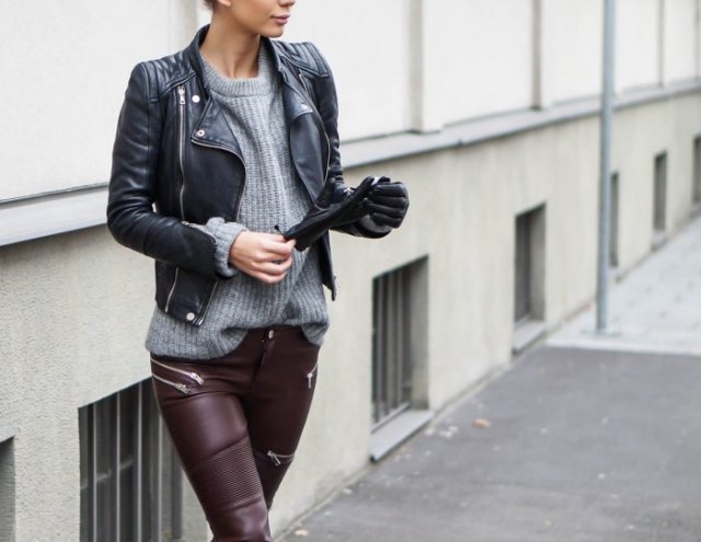 black leather jacket with gray rib sweater and moto pants