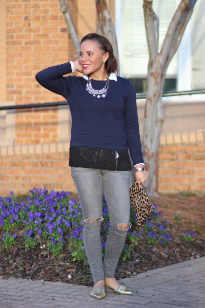 Dark blue fringe sweater with gray jeans