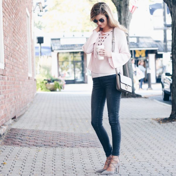 white, short-cut sweater with neckline and gray skinny jeans