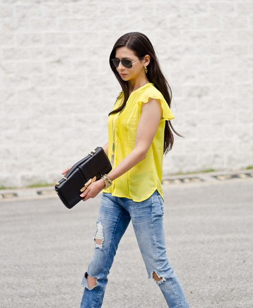 yellow blouse with cap sleeves and blue boyfriend jeans
