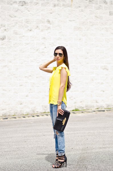 sleeveless blouse with yellow ruffled shoulder and boyfriend jeans with cuff